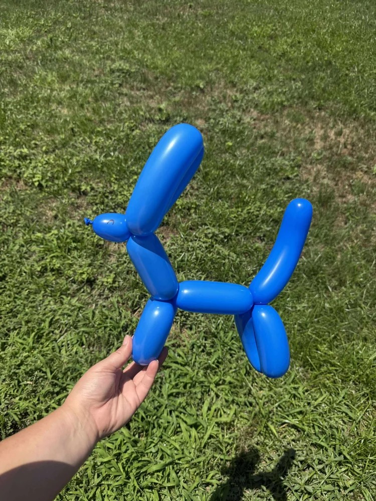 Classic balloon dog twisting at a Texas party