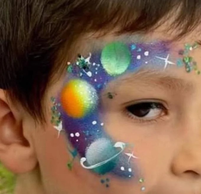 Galaxy face painting design for a kids party in Texas