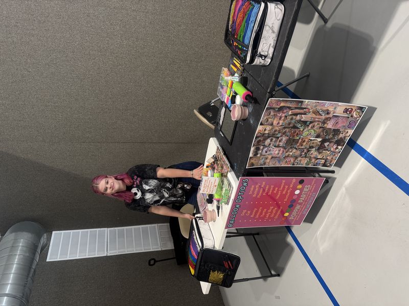 Poppin Partiez face painting artist setup at an indoor Texas event